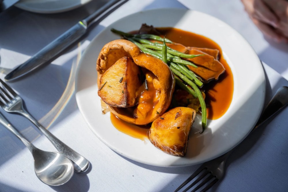 a table topped with a blue chair