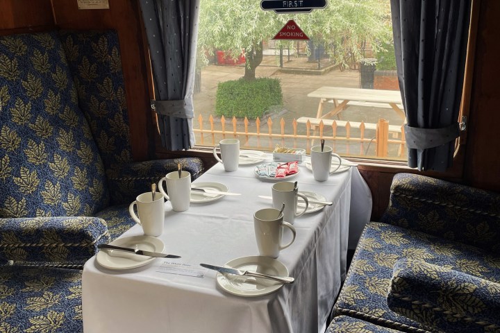 a bedroom with a large tub next to a sink