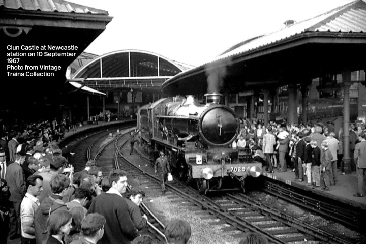 a group of people sitting at a train station