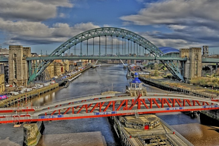a large long train on a bridge