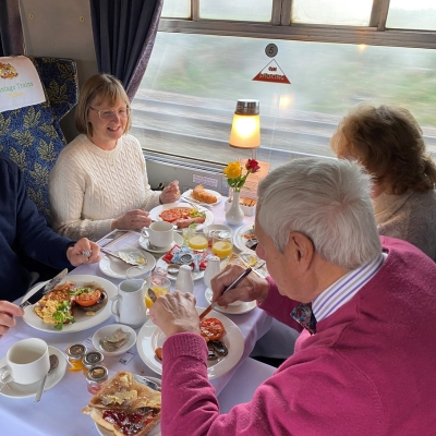 a cutting board with a cake on a table