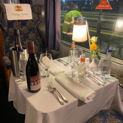 a table topped with a blue chair