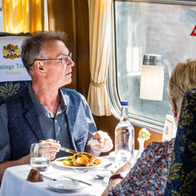 a table topped with a blue chair