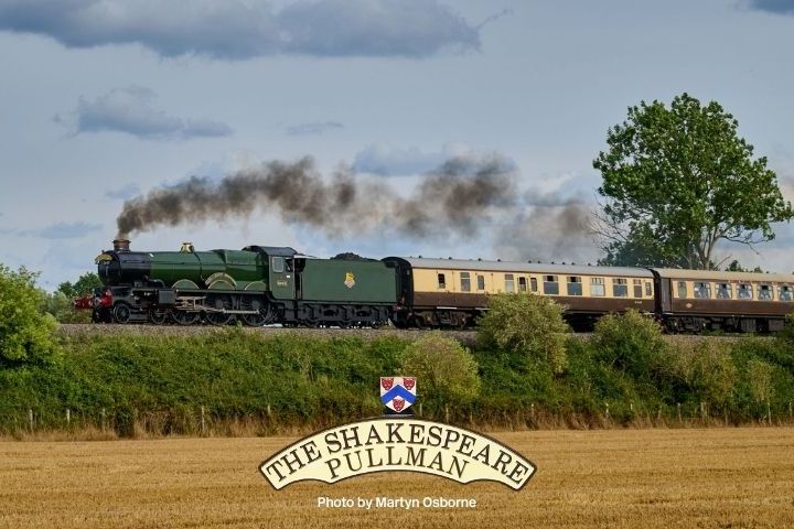Steam train traveling through countryside with smoke, labeled 'The Shakespeare Pullman'.